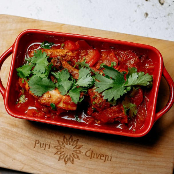 Chakhohbili from chicken slices of chicken in tomato sause with herbs