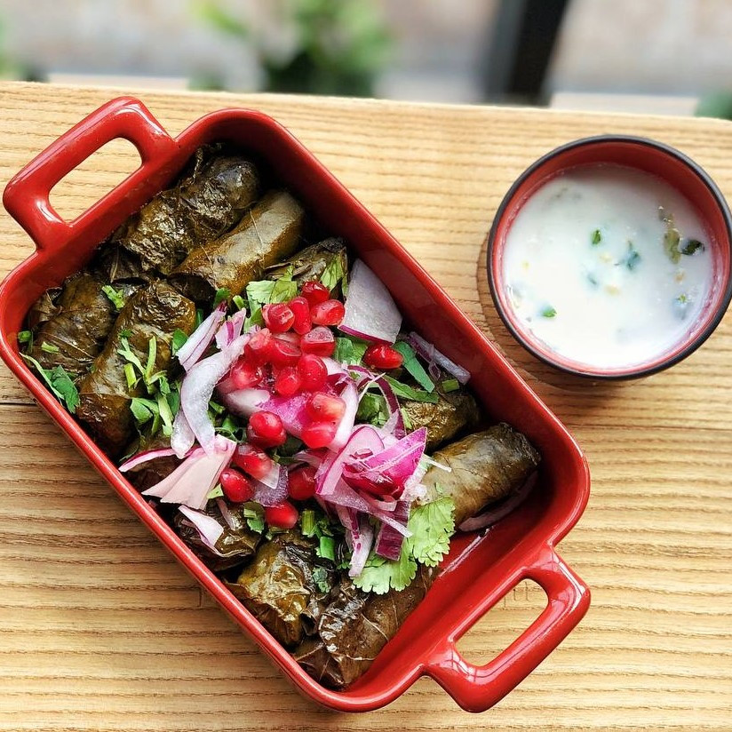 Dolma minced pork and veal with rice in grape leaves