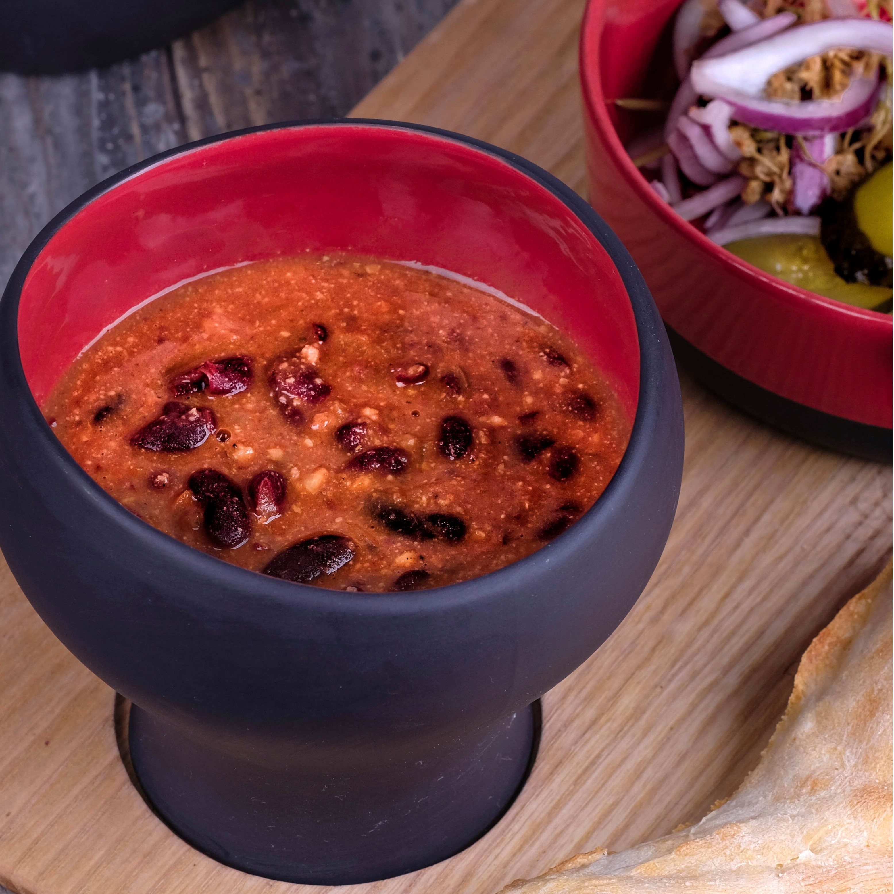 Lobio. Served with pickles, peppers, leeks and red cabbage