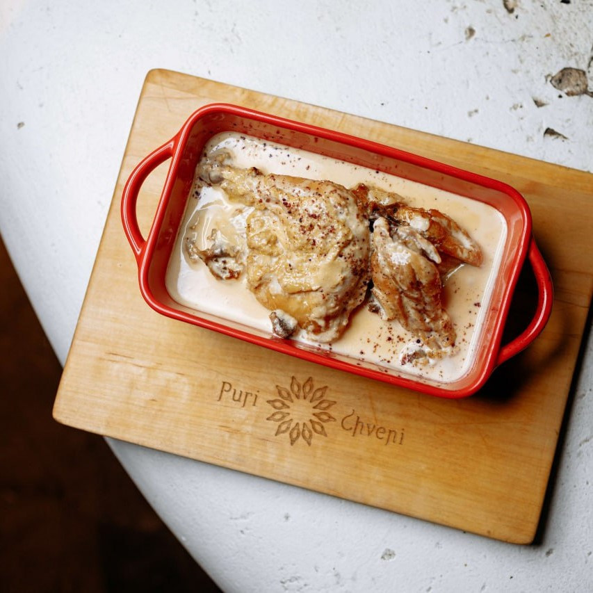 Chkmeryli, chicken stewed in a creamy garlic sauce with aromatic herbs