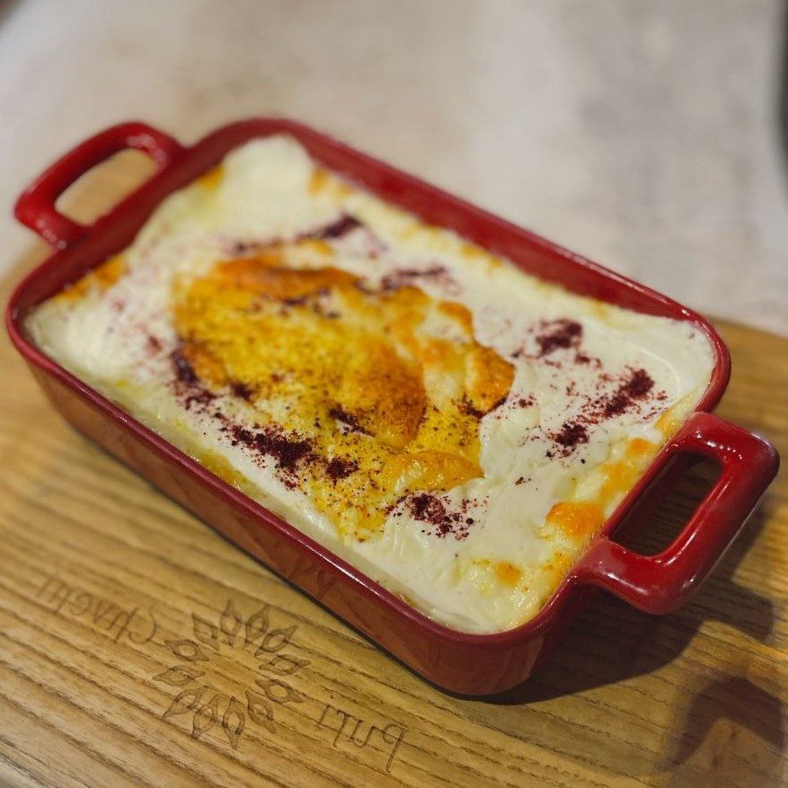 Suluguni cheese baked on the ketsi pan