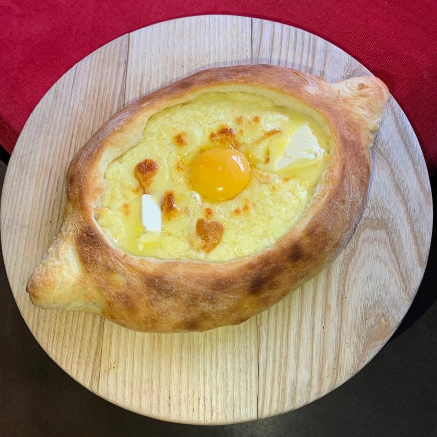 Khachapuri in Adjarian style with smoked suluguni
