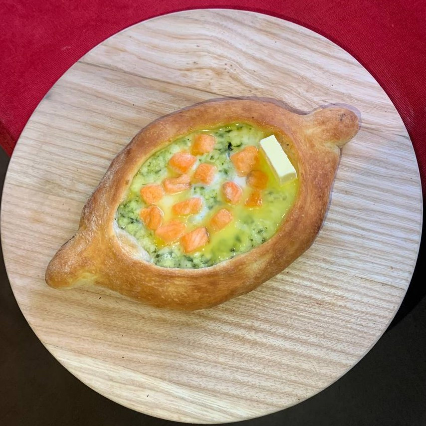 Khachapuri in Adjarian style, salmon and spinach